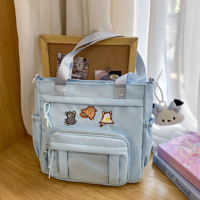 Cute messenger bag women's 2025 new Japanese pain bag large-capacity shoulder bag girl junior high school student portable tote bag