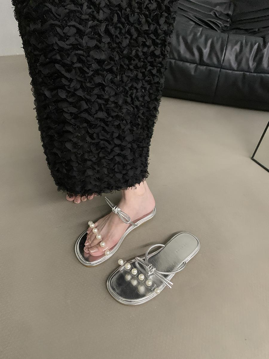 

Fairy wind flat-bottomed bow sandals women s shoes 2025 new summer outer wear holiday French beach cool slippers 35