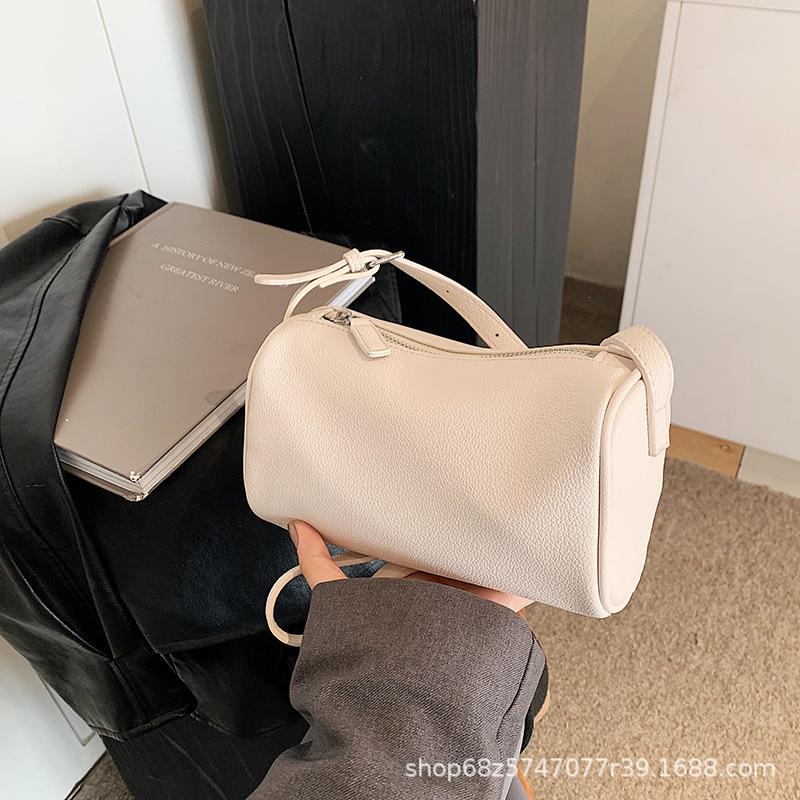 

Korean version wide shoulder strap cylinder bag women s 2025 spring new niche pillow bag fashionable versatile single shoulder messenger bag білий