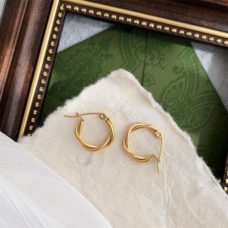 French Retro Gold-Plated Twisted Hoop Earrings - Titanium Steel Studs for Women, European-American Fashion.