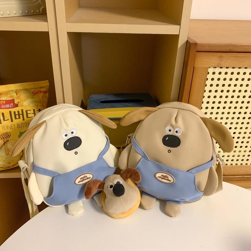 Small backpack female ins new cute cute cute big nose puppy cartoon bag girl soft heart oblique span bag