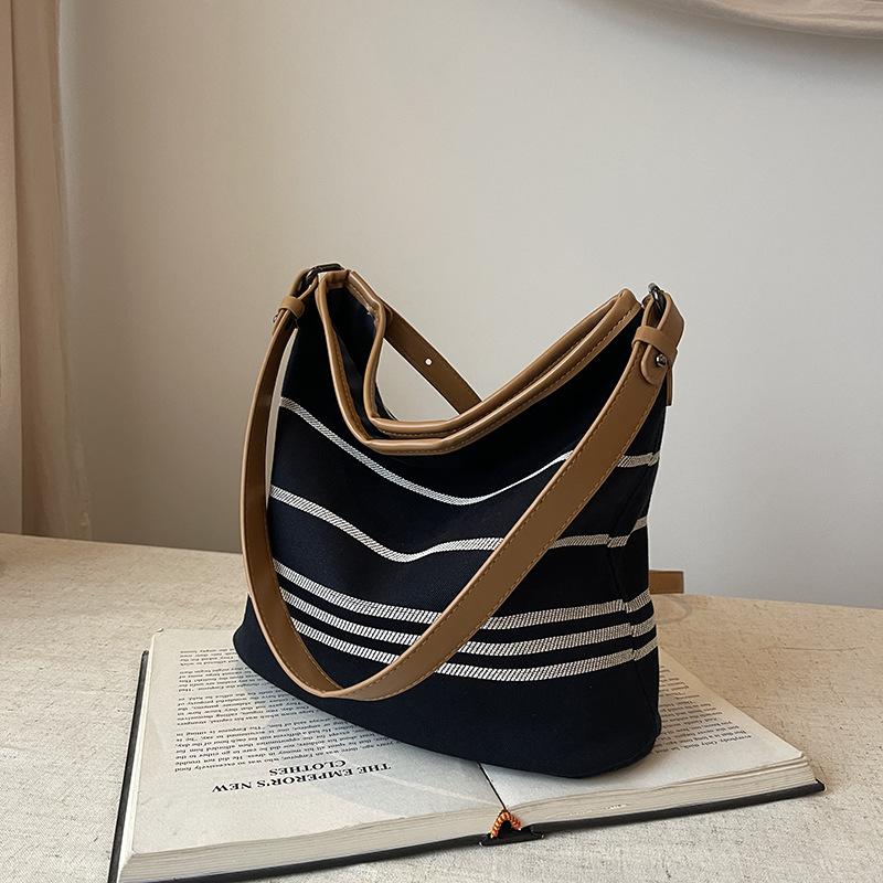 New fashion niche contrasting color striped bucket bag single shoulder oblique span trendy women's bag