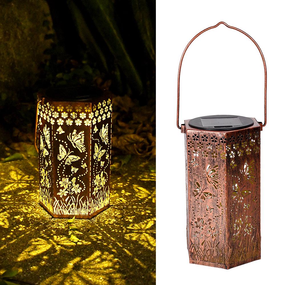 Outdoor Solar Wrought Iron Lantern: Waterproof Hollow Projection Table Lamp for Courtyard and Garden