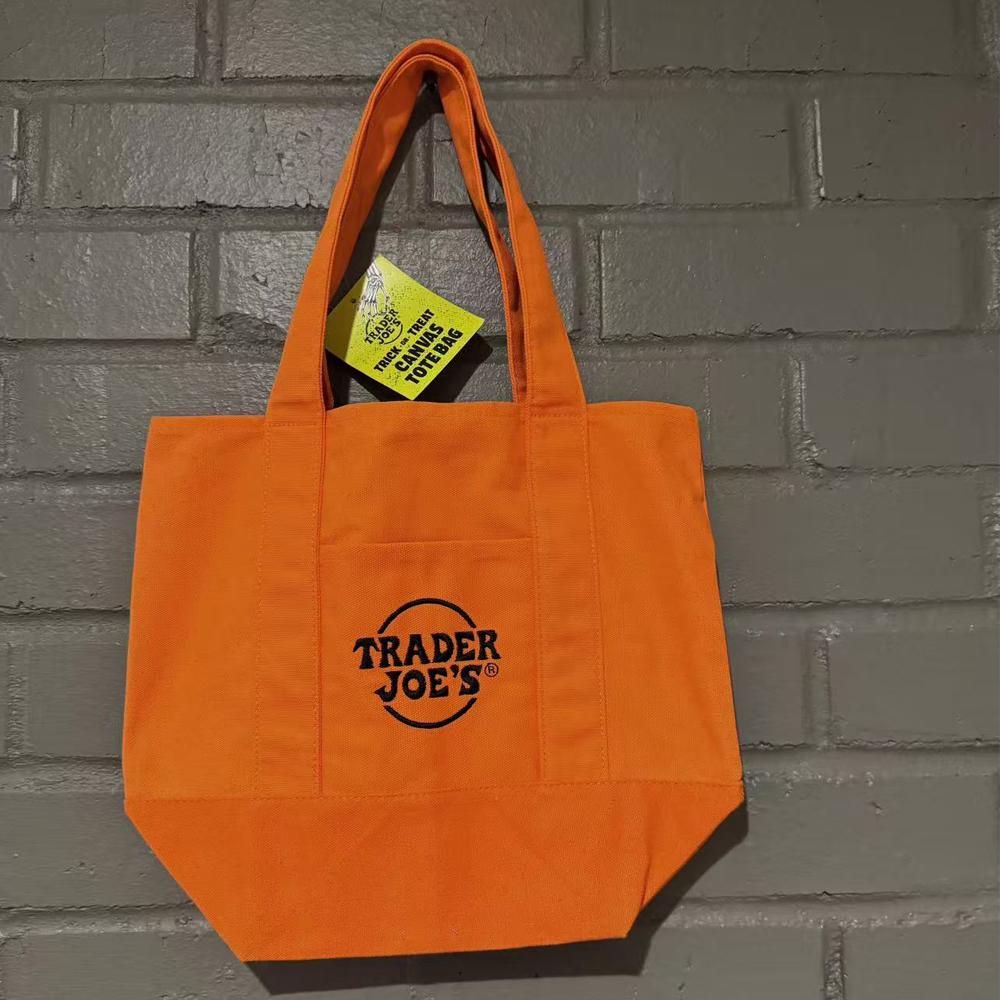 Official Trader Joe's Trick or Treat Tote Bag - Halloween Canvas Shopping Bag with Side Pocket for Groceries Pumpkin Patch
