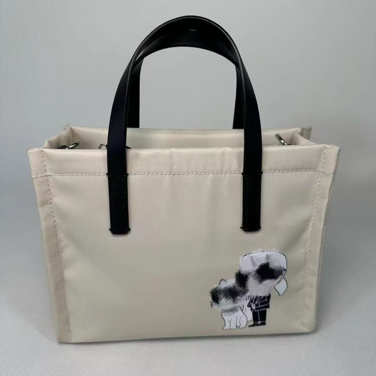 Модная женская нейлоновая сумка-тоут 2025 года с принтом мультяшного котенка 23x18x10 cm белый