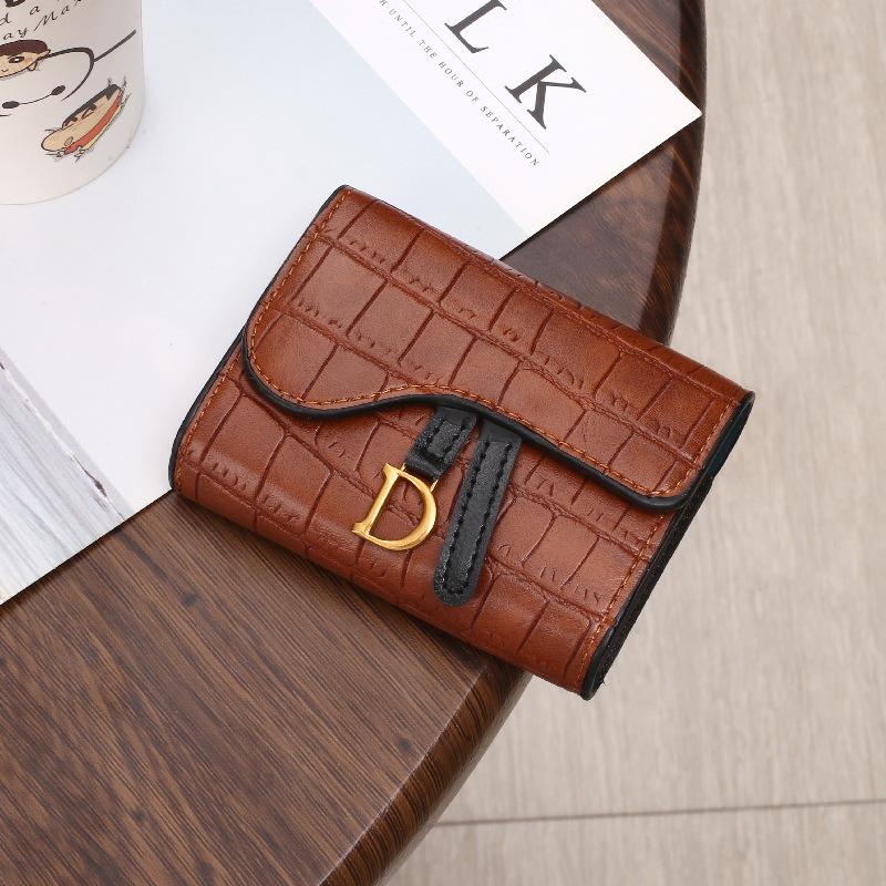 Women's 2022 Korean Style Crocodile Embossed Tri-Fold Wallet with D-ring Buckle Coin Pocket and Card Slots.