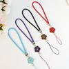 Creative Camellia Clover Lucky Phone Lanyard: Four-Leaf Clover Flower Woven PU Phone Chain Pendant.