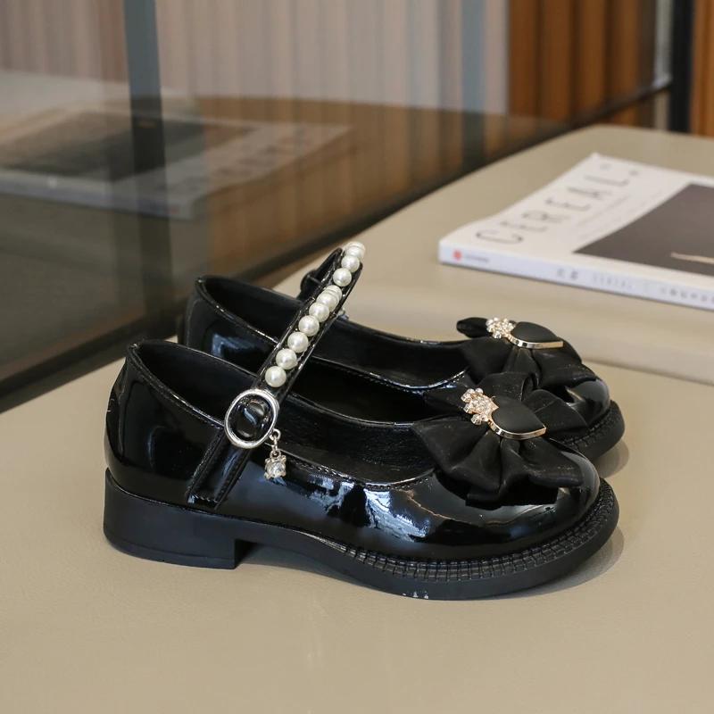 

Милые детские туфли принцессы 2024 года, элегантные детские кожаные туфли с бантом и короной, модные шикарные туфли для девочек с жемчугом Mary Janes 28 чёрный