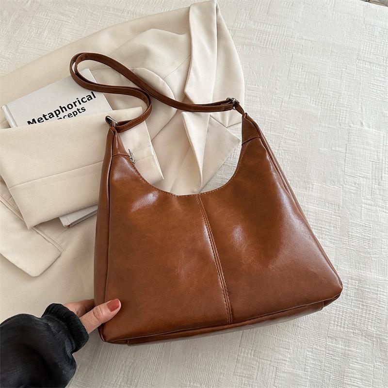 

Temperament simple large-capacity shoulder bag women s 2025 new versatile ins messenger bag breathable retro tote bag коричневий