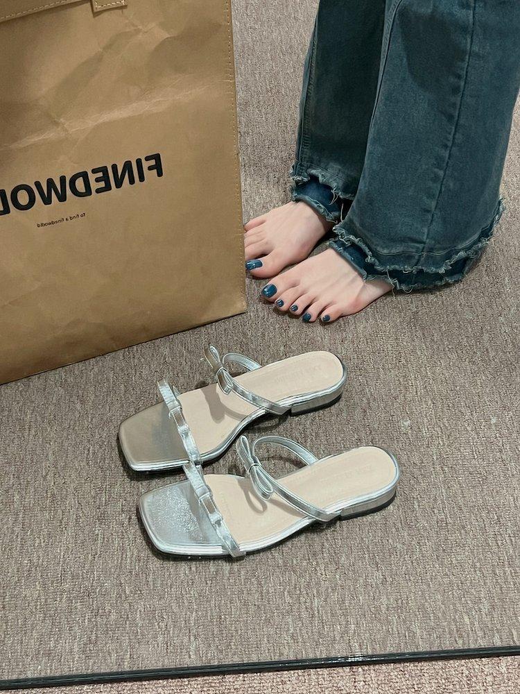 

Fairy wind sandals wear women s shoes in spring and summer 2024 new thick heel square head silver bow word sandals 35
