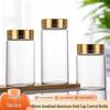 65mm Thickened High-Transparency Glass Bottle with Gold Oxidized Aluminum Screw Cap for Cereal and Grain Packaging.