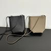 Vento de fileira nicho importado couro bovino de primeira camada bolsa mini balde para o dia a dia estilo minimalista ombro portátil bolsa de telefone celular transversal