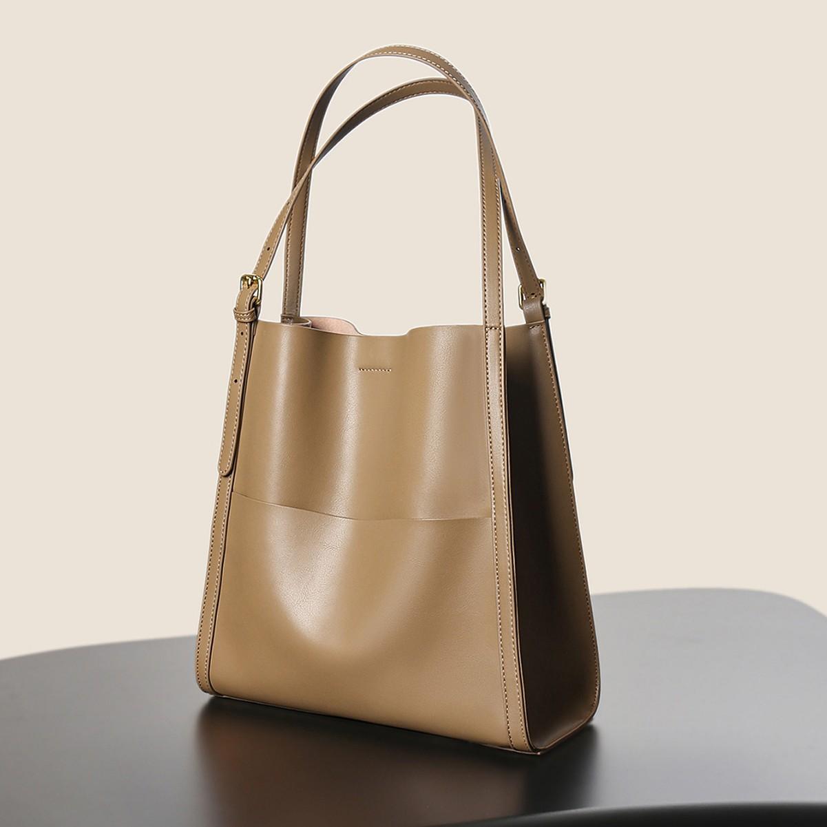 

Leather women s bags, high-end niche shoulder bags, new bucket bags, fashionable and versatile commuter tote bags кавовий