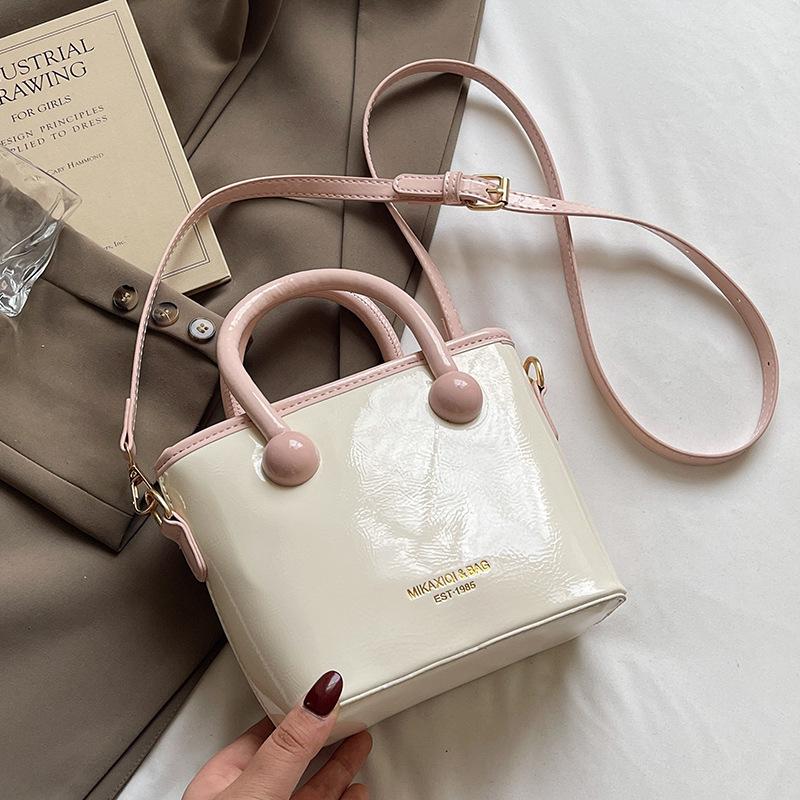 Spring and Summer Fashion New Creamy Simple Portable Bucket Bag Korean Version Casual Commuting Versatile High-end Messenger Bag