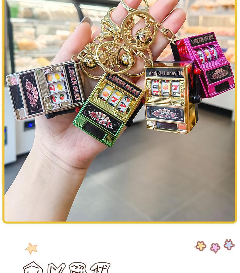 Gold-Plated Creative Tiger Fruit Machine Keychain Toy with Lottery Play Feature