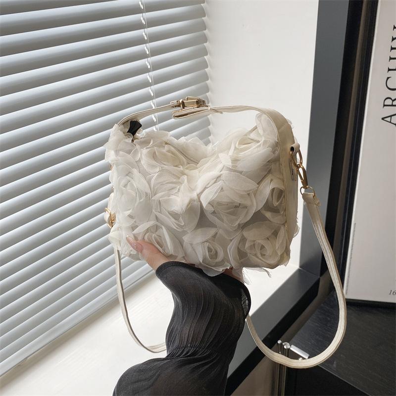Internet celebrity fashion three-dimensional flower handheld women's bag 2025 new fairy bag cheongsam bag versatile oblique span bag dinner bag