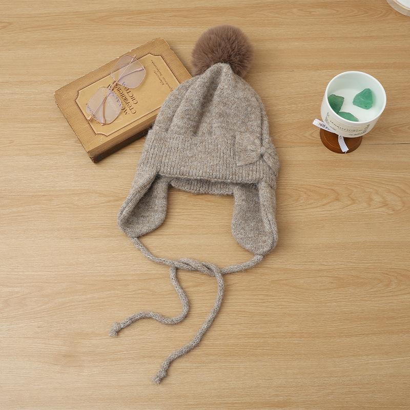 Hat women's autumn and winter cute hairball knitted wool hat thickened ear protection warm fashionable versatile