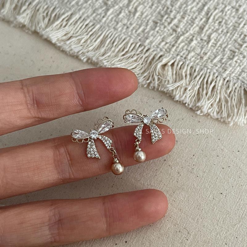 Korean Zircon Bow Pearl Stud Earrings - High-End, Versatile & Elegant.