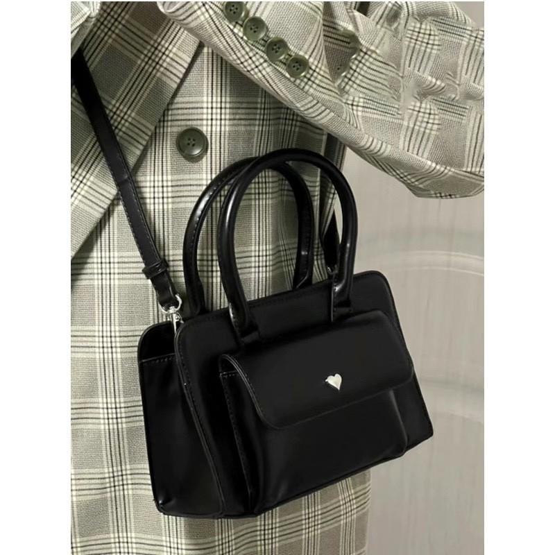 Spring niche casual fashion versatile high-end textured bag women's hand shoulder oblique span small square bag