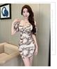 Spring and summer new sexy celebrity suspender V-neck printed dress temperament high waist and thin hip-wrapped mesh skirt women