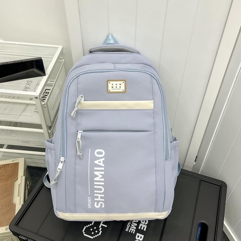 

Large capacity schoolbag female simple solid color junior high school student backpack wide shoulder strap ridge protection casual backpack fashion сірий колір