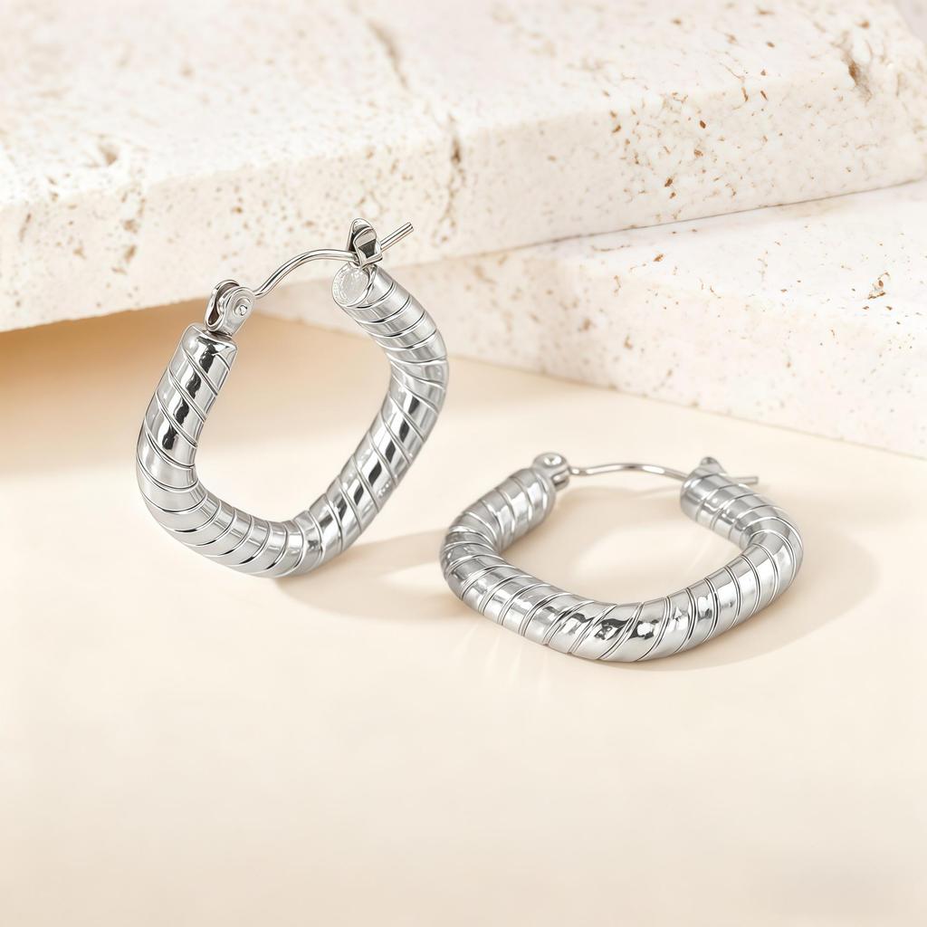 Orecchini a Cerchio Geometrici Intrecciati Europei e Americani in Acciaio al Titanio - Design Elegante e Unico per Donna