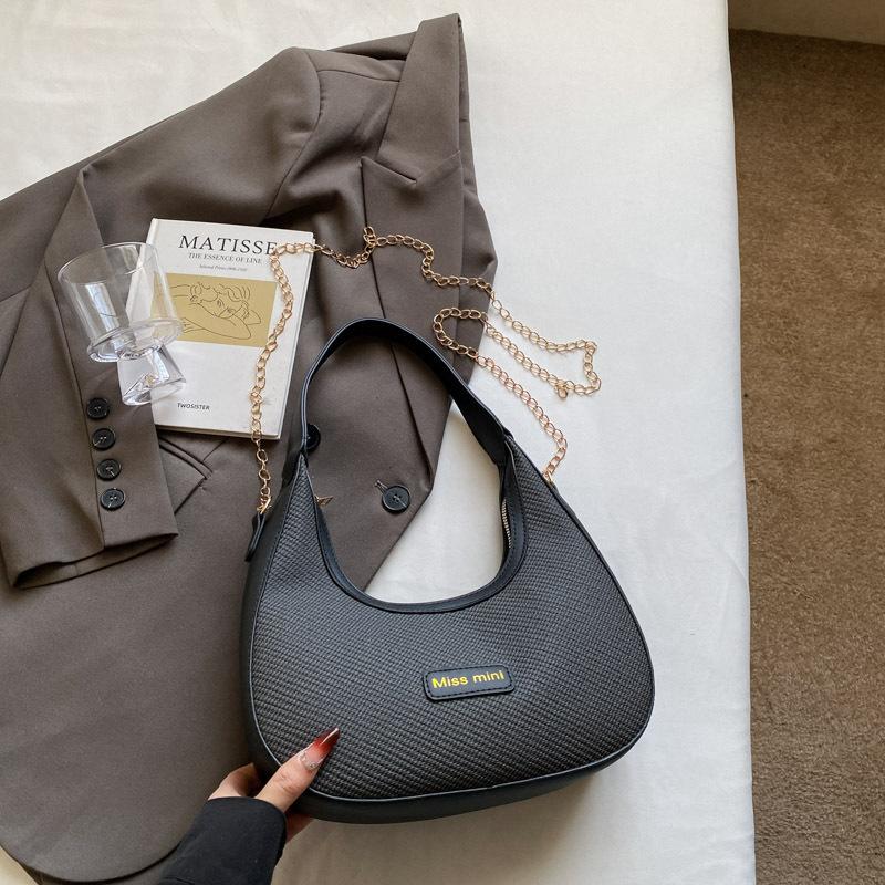 

Модный тренд Сумка подмышку на одно плечо Новый весенний нишевый дизайн Портативная сумка-мессенджер Сумка-пельмень Женщины чёрный