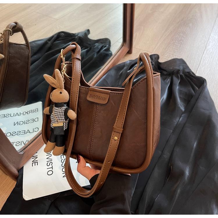 

Преміальна нішева сумка з відчуттям, жіноча осінь-зима 2024, нова ретро-універсальна сумка через плече, популярна сумка-відро темно-коричневого кольору