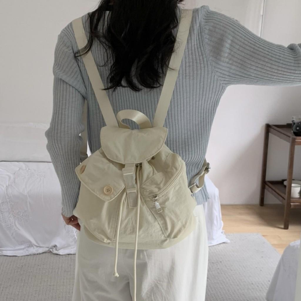 IELGY new Korean niche design outdoor pocket button drawstring double shoulder nylon backpack