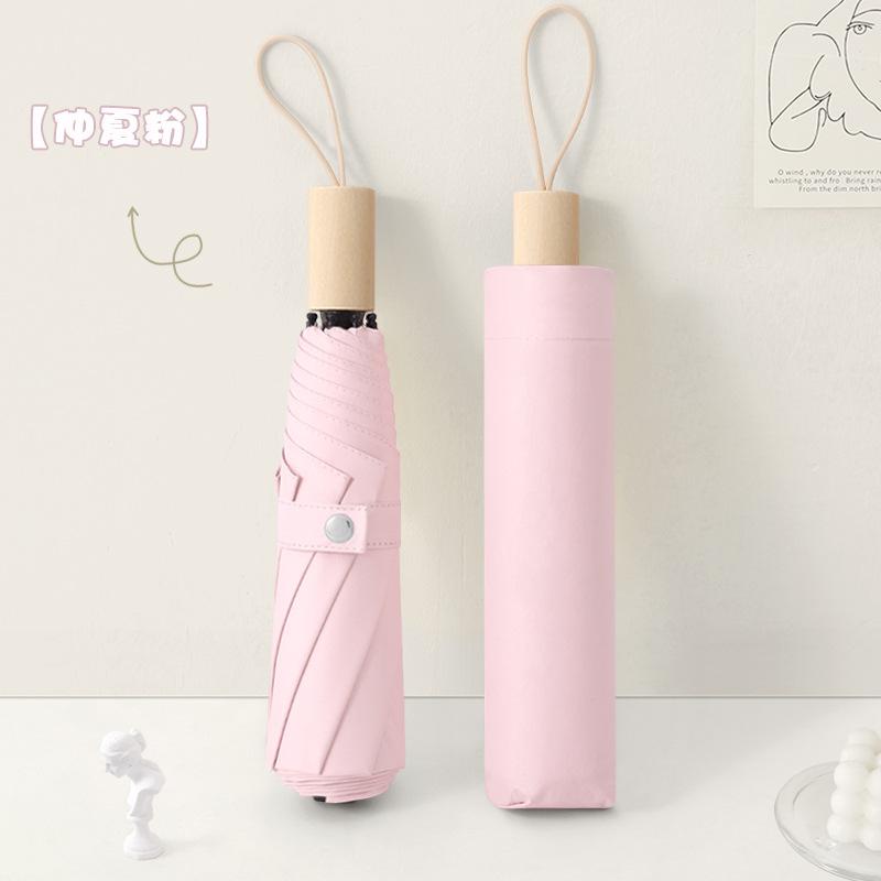 New three-fold simple plain color windproof and sun protection creative solid wood handle female vinyl parasol