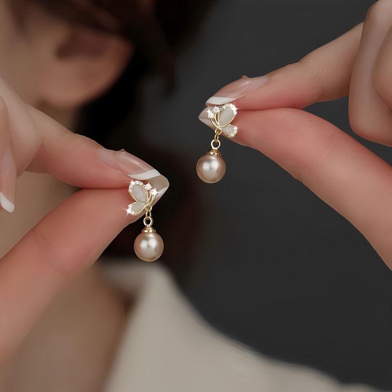 

Французские Дизайнерские Серьги-пусеты с бабочками, жемчугом и опаловым камнем, женские, изысканные, стильные и универсальные серьги, ювелирные изделия Butterfly champagne pearl cat s eye stud earrings