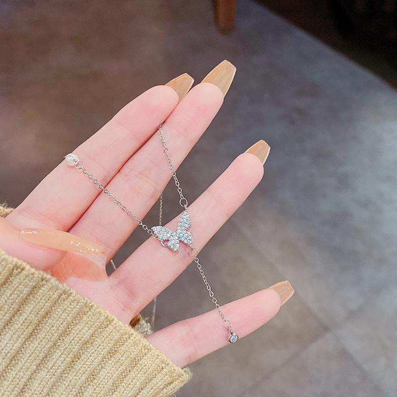 

Популярное корейское ожерелье из титановой стали с длинной кисточкой и бантом для женщин: Легкая роскошь, универсальная, изысканная ключичная цепочка