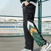 Li Ning Loose Fit Tapered Woven Sports Long Pants Men Bottoms Dynamic-Green AYKQ789-3