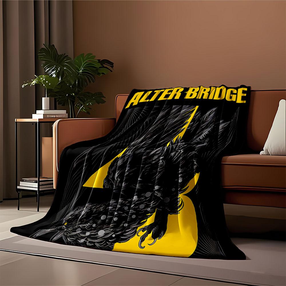 A stylized black bird entwined with yellow text and abstract line art. for all seasons blanket lunch break throw gift