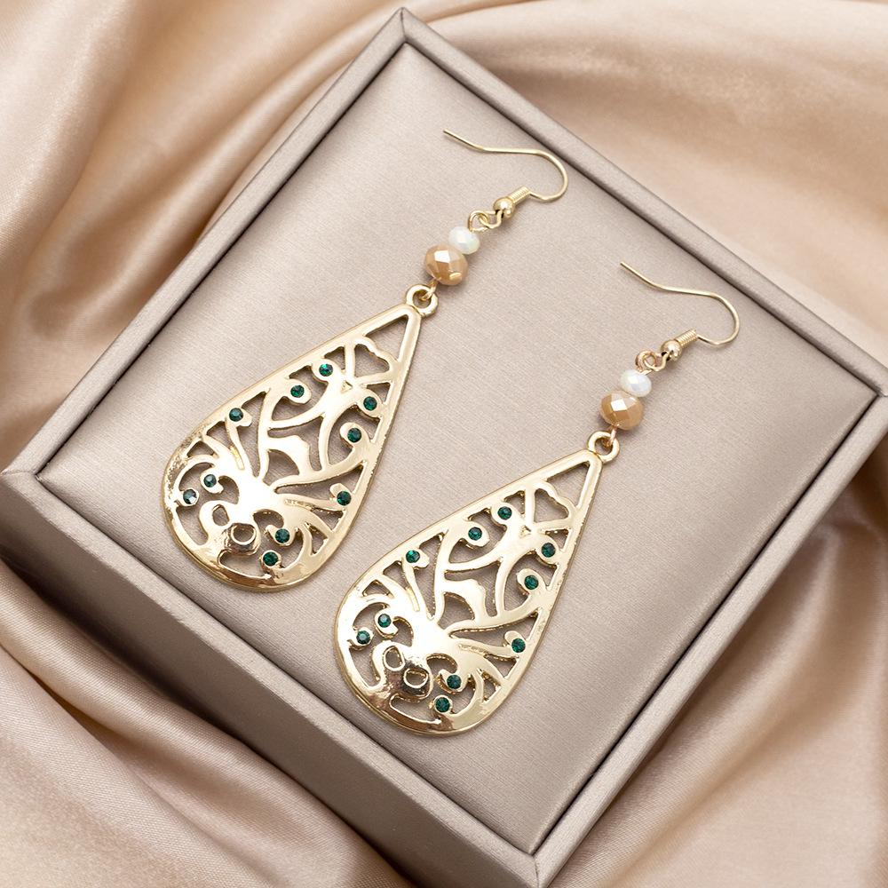Retro Teardrop Earrings with Hollow Floral Design and Rhinestone Accents