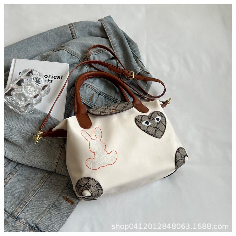 

Popular bag women s 2025 summer new Oxford cloth messenger bag printed cute cartoon casual women s handbag