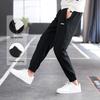 Li Ning Logo Simple Solid Color Mid Waist Breathable Versatile Tapered Knit Sports Pants Unisex Pants Black AYKV809-1