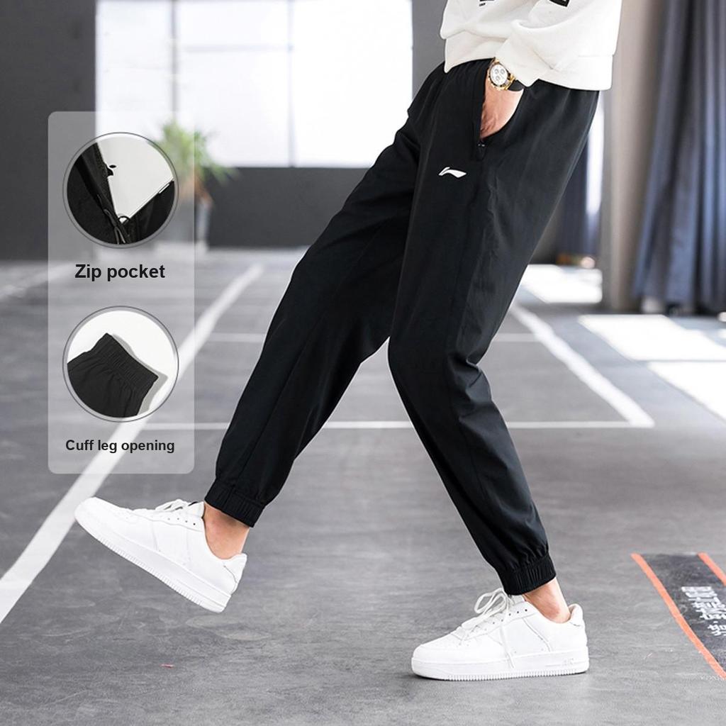 Li Ning Logo Simple Solid Color Mid Waist Breathable Versatile Tapered Knit Sports Pants Unisex Pants Black AYKV809-1
