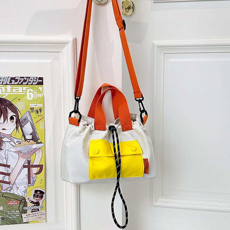

New casual contrasting color drawstring bucket bag versatile nylon cloth tote bag shoulder messenger bag small tote bag білий