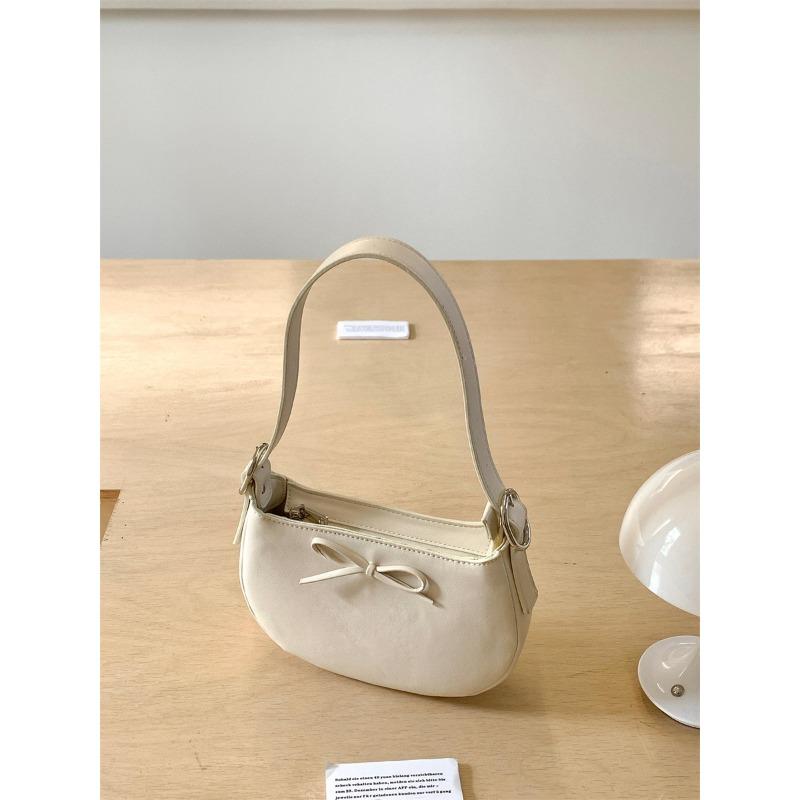 Niche style underarm bag women's oval simple small handbag fashion bow spring and summer new shoulder bag women