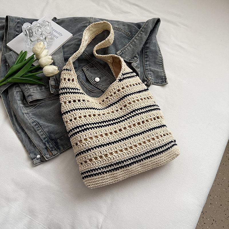

2025 summer new niche sweet wind hollow woven tote women s bag commuting lazy feeling large capacity shoulder bag