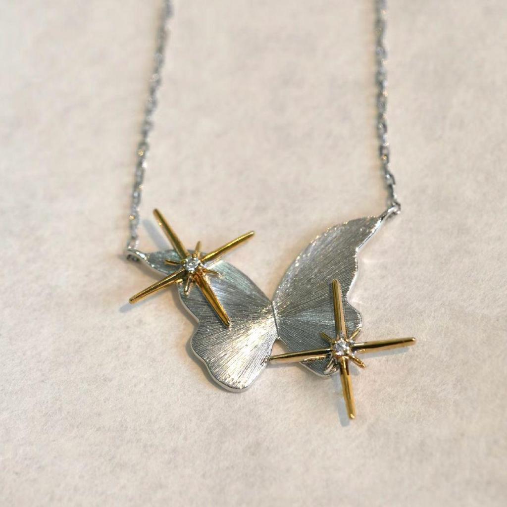 

Жіноче мінімалістичне кольє з метеликом та зіркою: Стильний, Нішевий Дизайн з Матовою Обробкою для Відчуття Легкої Розкоші Чокера.