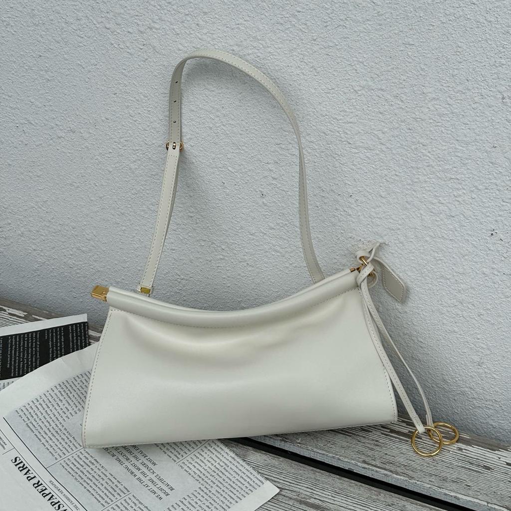 2025 neue Sommer- und Herbst-Clip-Tasche Französische Nischen-Leder-Schulter-Unterarmtasche Leder Retro-Mode Baguette-Tasche Damen