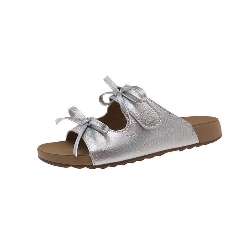 Schleife Flachboden Koreanische Version Ein-Wort-Slipper für Damen Sommerbekleidung 2025 neue Modelle mit Röcken Lässige Strand-Cool-Slipper