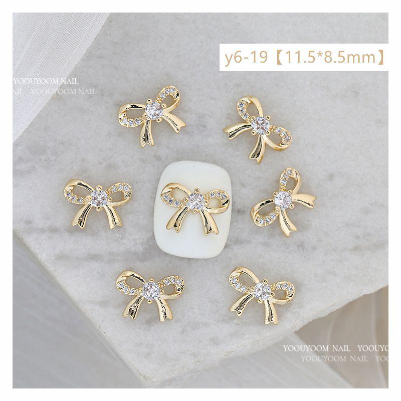 

Silver Zircon Starburst Bow Nail Art Pendant - Wearable Diamond Nail Decoration