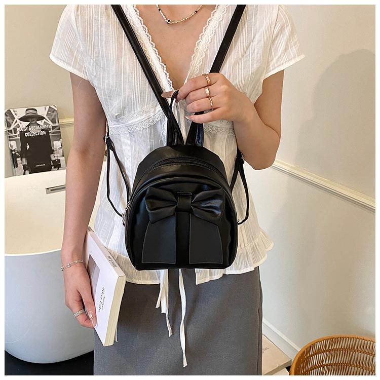 Sac à dos en cuir synthétique style coréen avec nœud papillon pour femme Sac à bandoulière matelassé léger