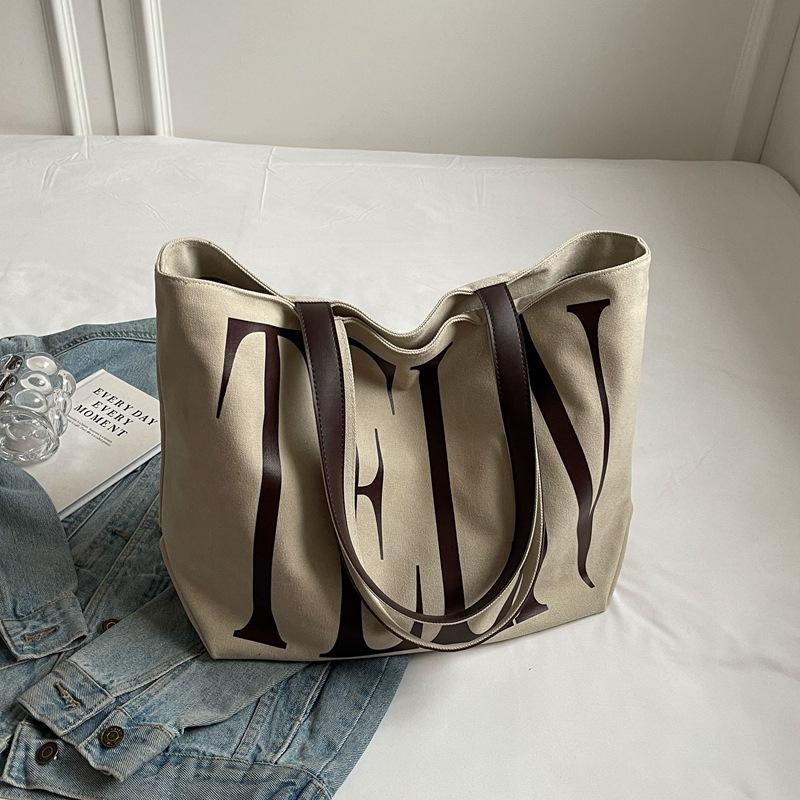 Fashion Korean version ins niche letter printed canvas bag 2025 new casual mommy shopping bag shoulder bag