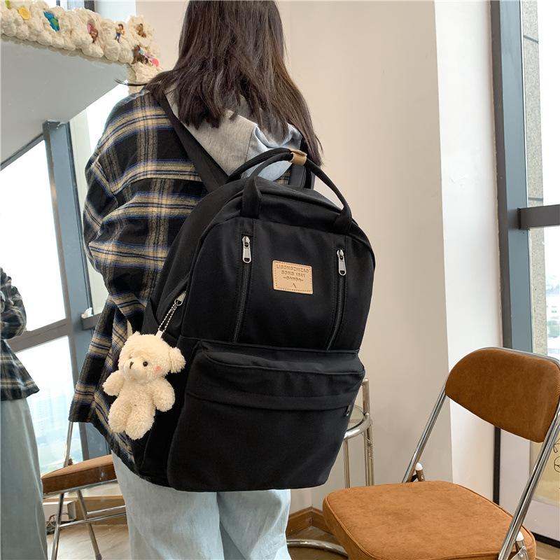 Korean version of schoolbag female college student versatile large-capacity portable lightweight and simple junior high school student travel backpack