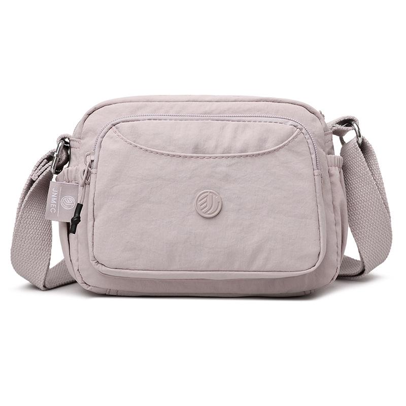 

Жіноча нейлонова сумка кросбоді Осінь 2025 - Велика місткість, Багато відділень, Модний квадратний дизайн 21x14x15 cm світло-фіолетового кольору