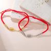 Gioiello Sportivo Minimalista in Acciaio Inossidabile con Intaglio Racchetta e Cordino Intrecciato Personalizzabile